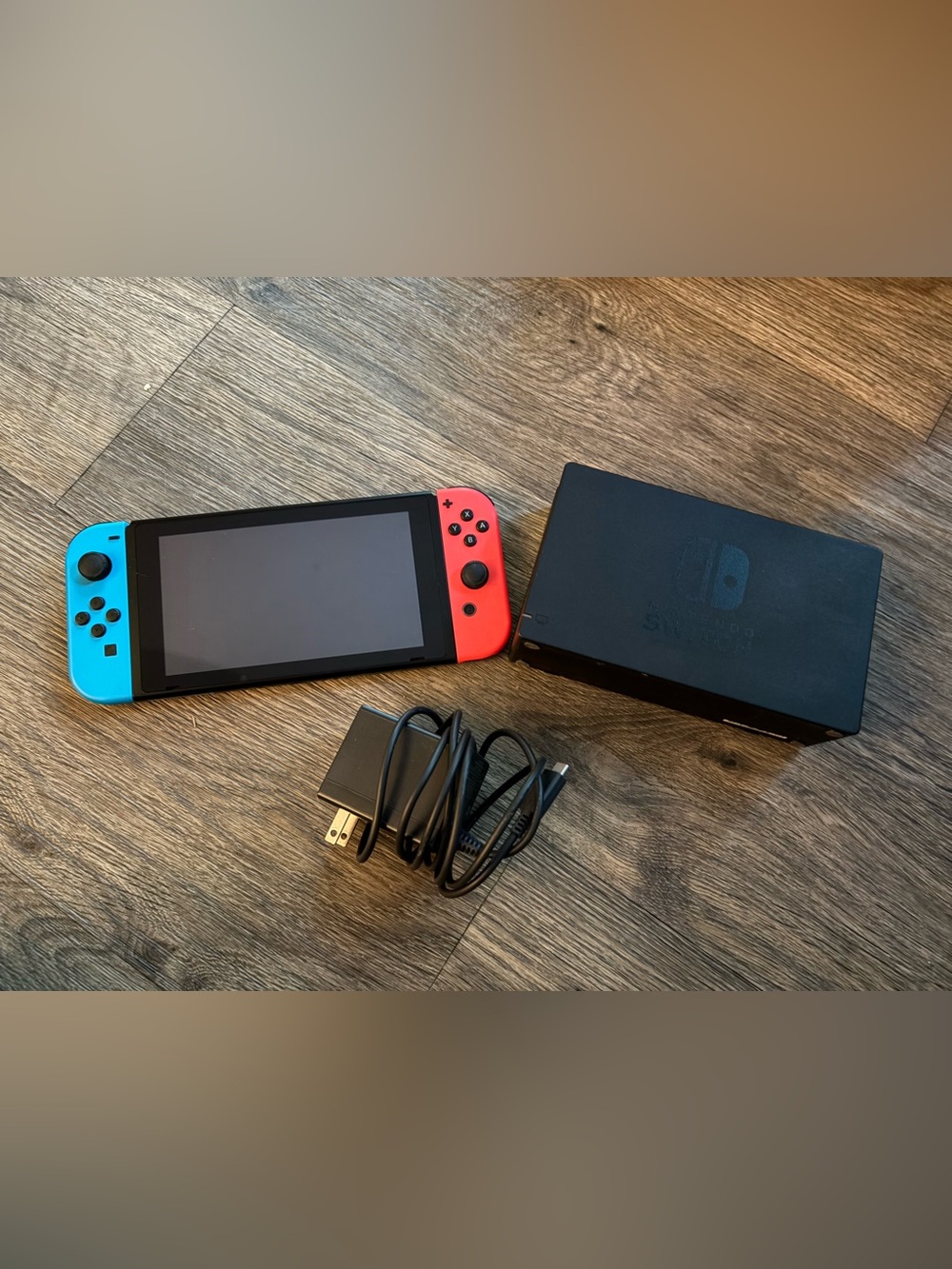 Nintendo Switch with both Joy-Cons, charger cord and Black Dock